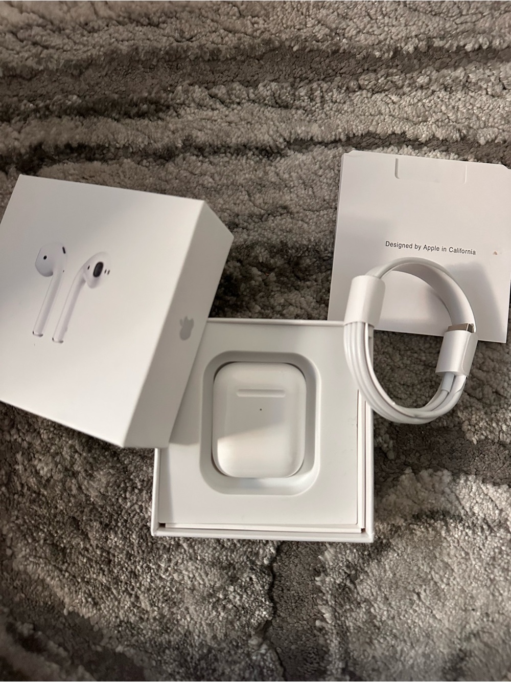 Apple AirPods with Charging Case and Lightning Cable - White